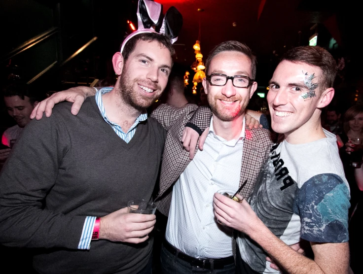 three men with faces painted to look like they are having fun