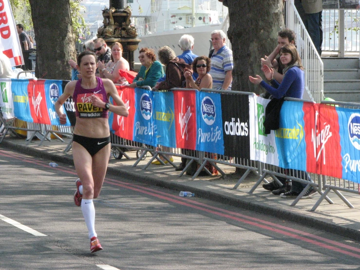 a woman running in the race is by some fans