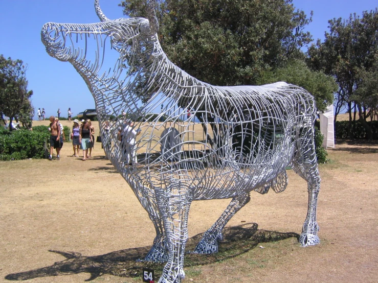metal horse sculpture with people watching on the other side