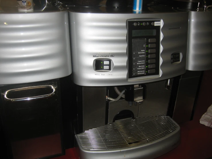 an espresso machine sitting inside of a coffee bar