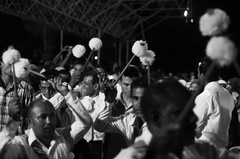 the crowd is lined up with cheerleaders dressed in black