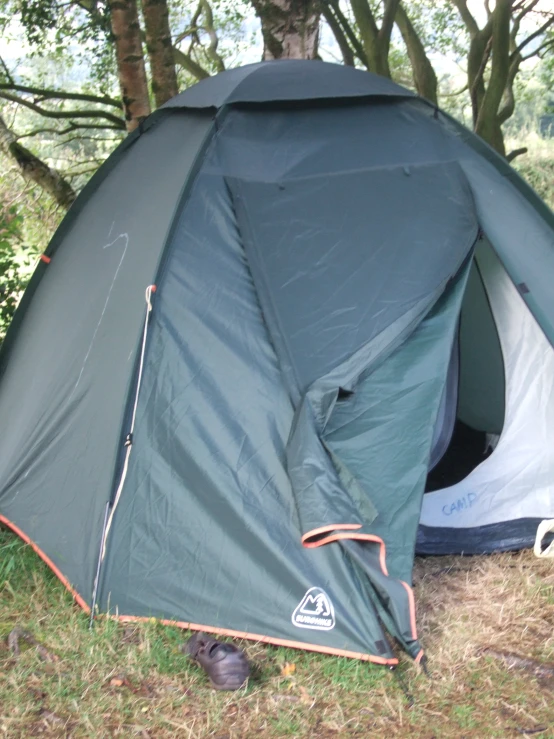 there is a tent set up on the grass