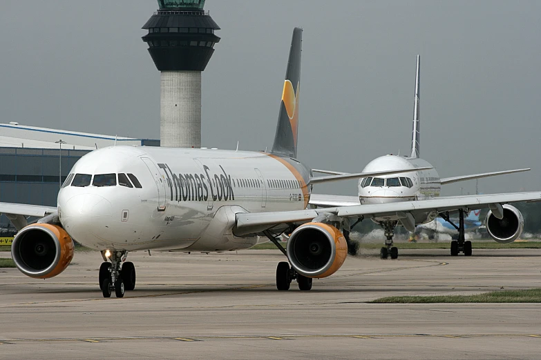 a large passenger jet sitting on top of an airport tarmac