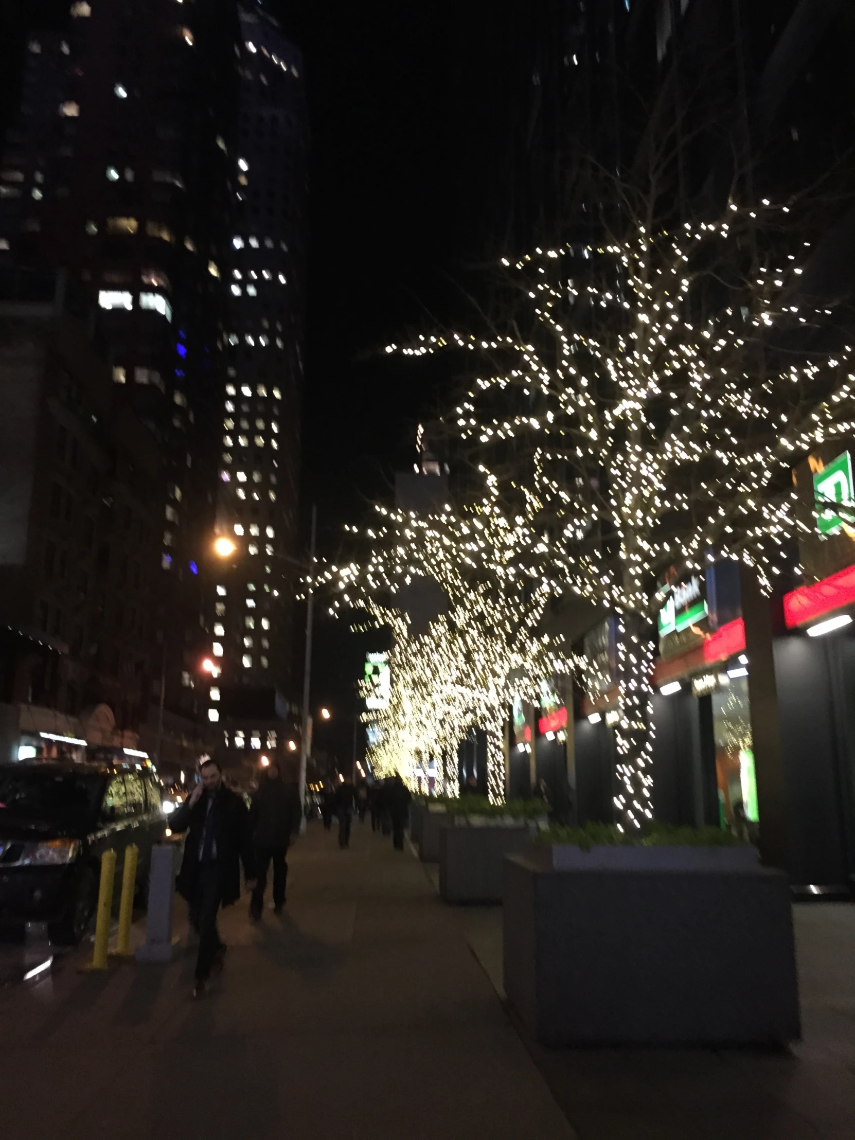 a city street with a christmas light display