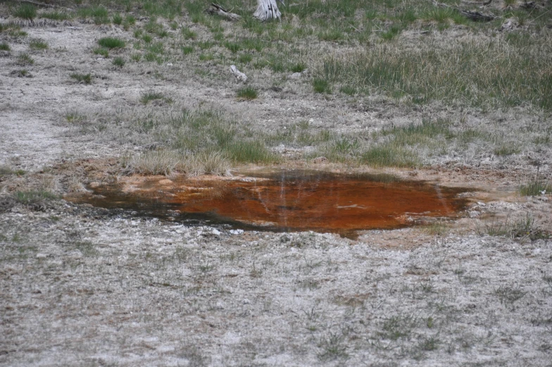 a large dle in the ground that is melting