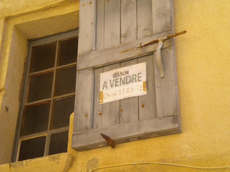 a sign that is on a window that reads french