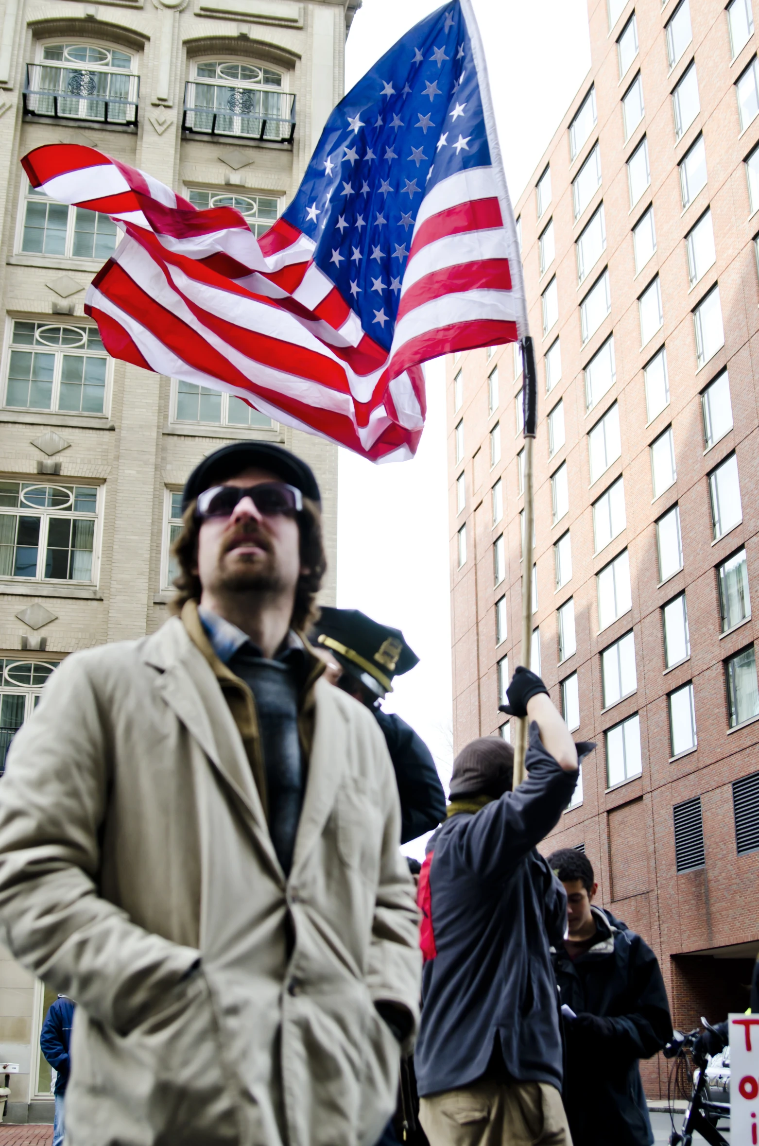 an american flag with people around it