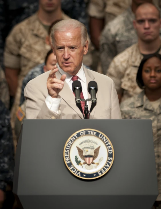 a man gives a speech to the military