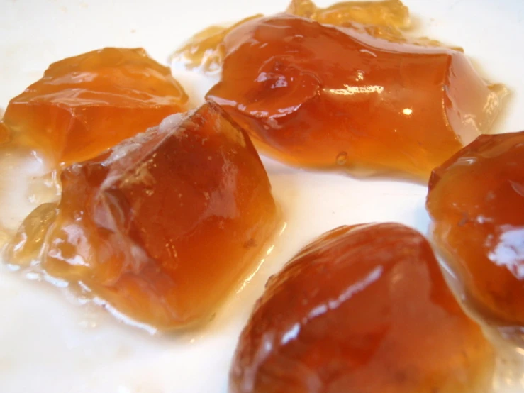 a close up of some candies with syrup