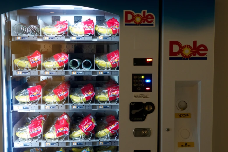 a snack vending machine with its lights on