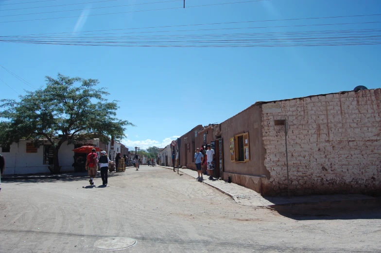 a road in front of several people standing around