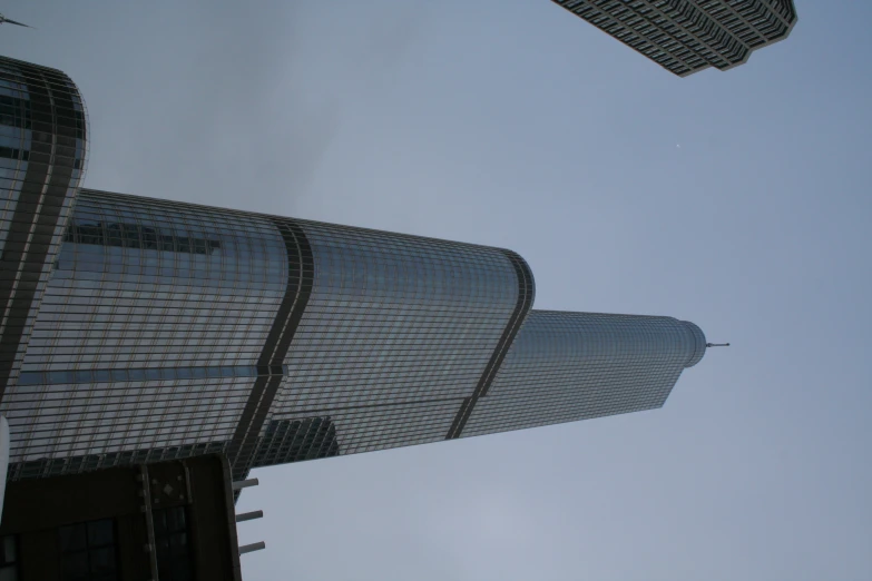 a large tall building towering over the city