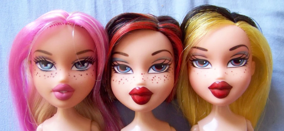 3 different color hair doll heads of three different sizes