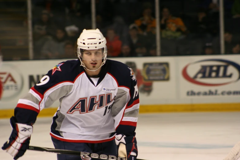 the hockey player is in position for his turn