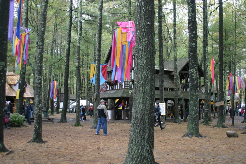 a tree house in a forest full of people