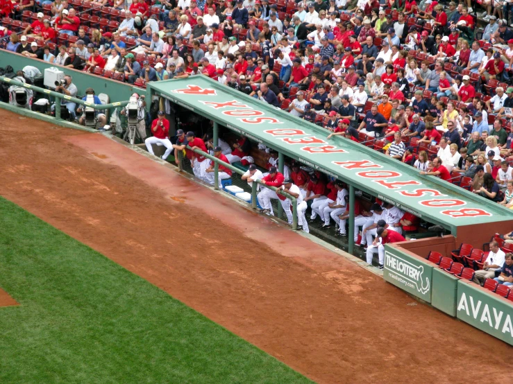 some baseball players are on a dirt field