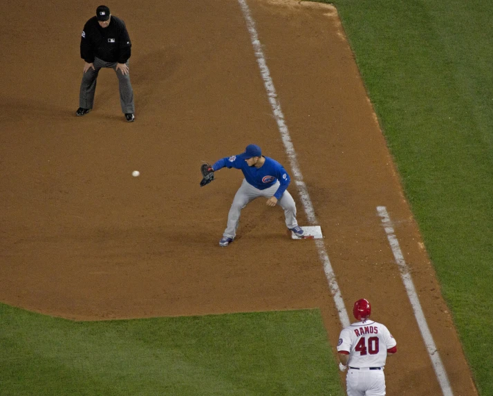 a man is pitching a baseball during a baseball game