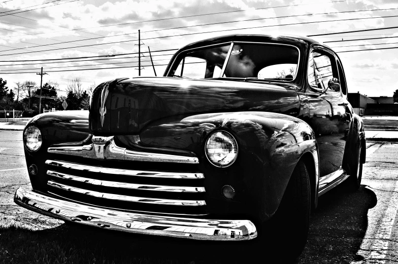 an old pick up truck sitting in a parking lot