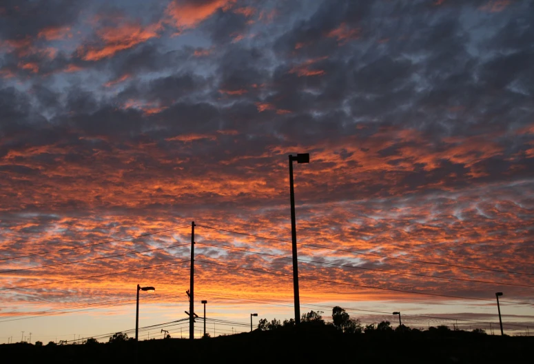 the sky is very cloudy and colorful at dusk