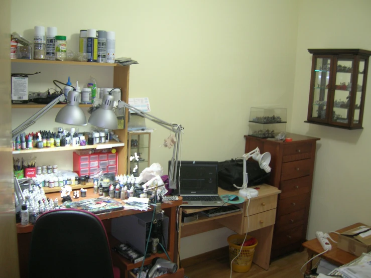a desk covered in lotions of craft supplies