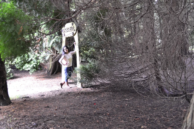 the woman is running to get to the sign