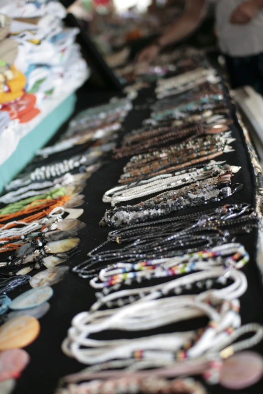 various different types of necklaces are on display