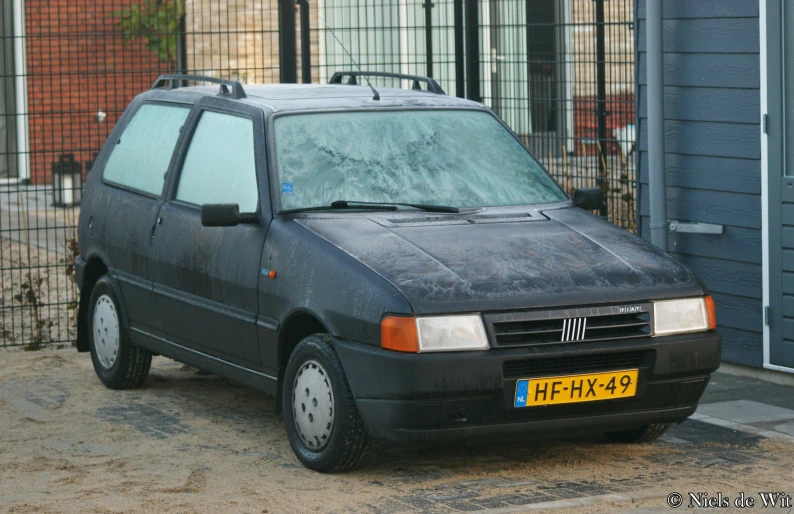 a gray car parked on the side of the road