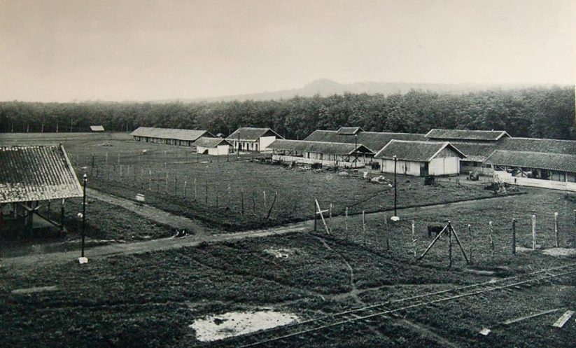 an aerial po showing a group of houses near trees