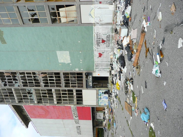 a large building with many windows that have broken down