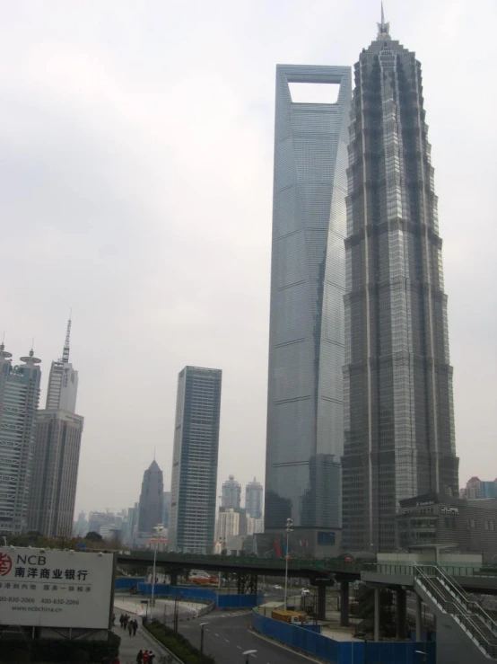 a street with several cars in front of tall buildings