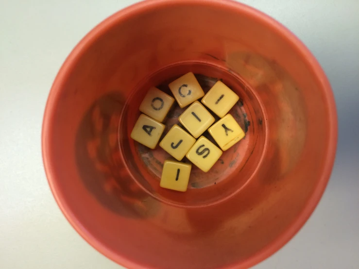 a bowl with squares that spell out numbers