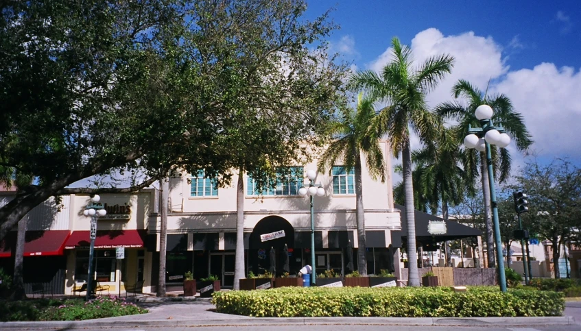 a building with a sign is on the street