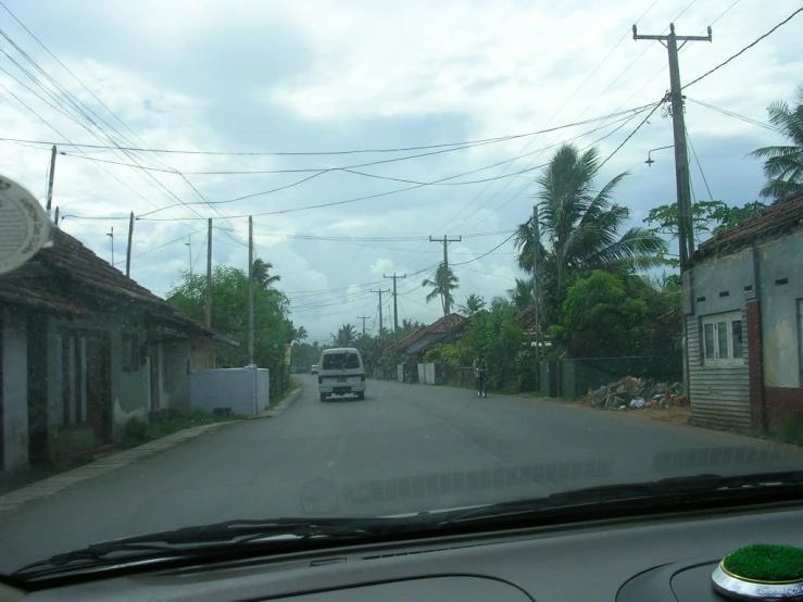 a small car is on a very wide street