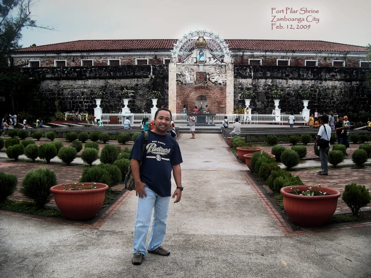 a man standing in front of an open garden