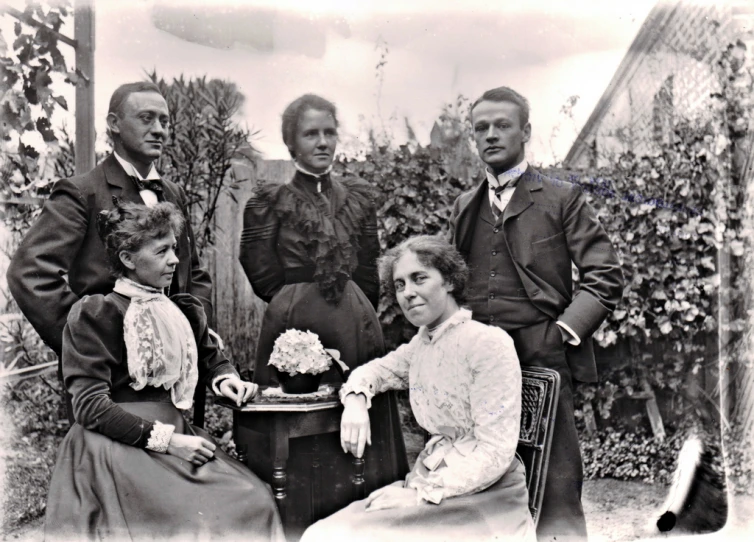 black and white pograph of old fashioned family posed for a portrait