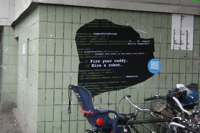 a bike sits next to a large mural of a man's silhouette