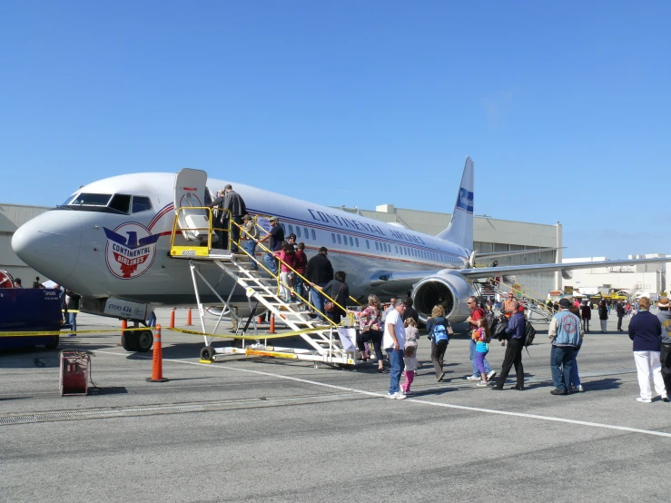 a airplane at an airport getting passengers off