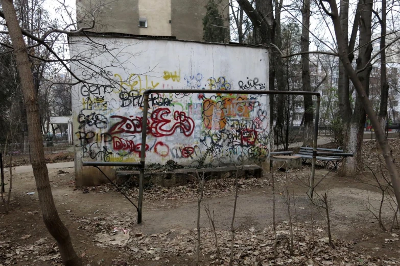 an old run down building with some graffiti all over it