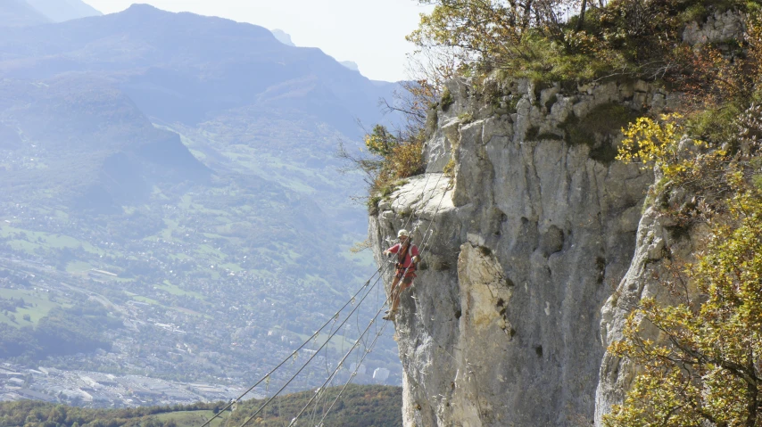 an old rope carves along a cliff side