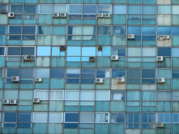 a blue tile pattern with multiple windows and bars