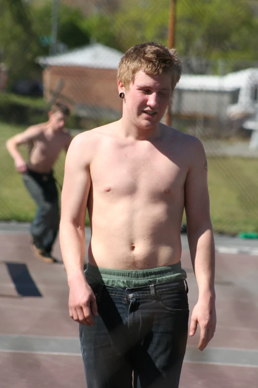 a young man with a  is on a skateboard