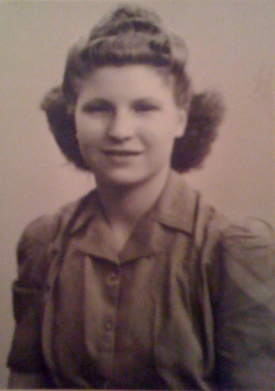 old pograph of a woman with hair blowing in the wind