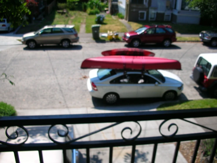 a picture of two vehicles that are parked in front of a house