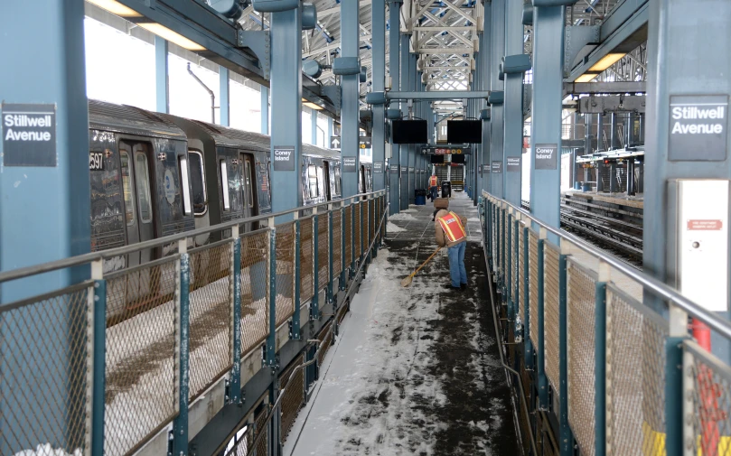 there are several people walking along the snowy tracks