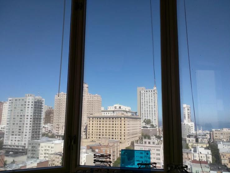 there is a window that has the view of some buildings