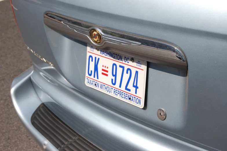 the front of a car with license plates and a sticker for usa