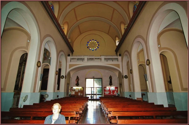 a person sitting at a table in a church