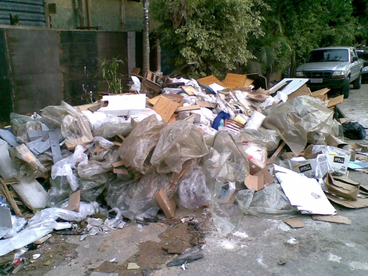 there are garbage and other items left out on the side of a road