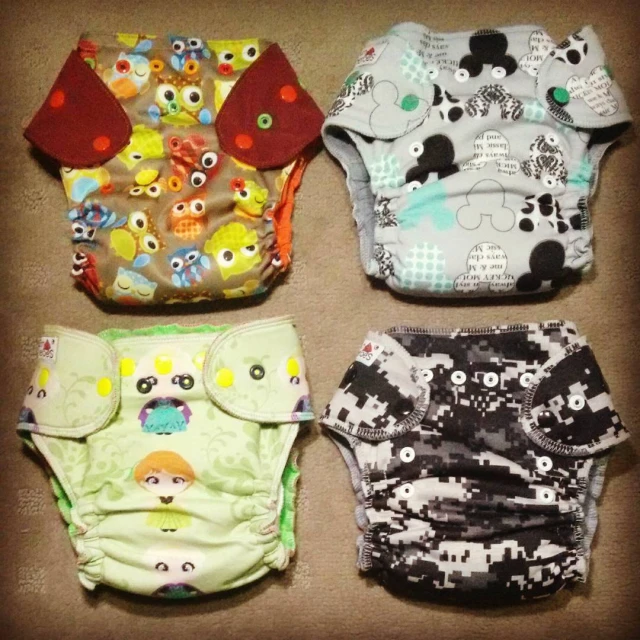 four different ones, a baby - sized or adult size with an owl print, and some smaller ones