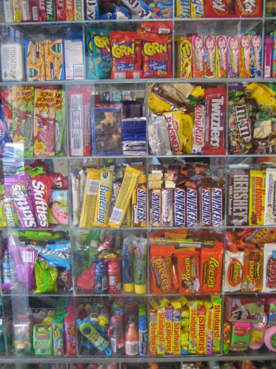 an assortment of snacks, candy bars and other treats